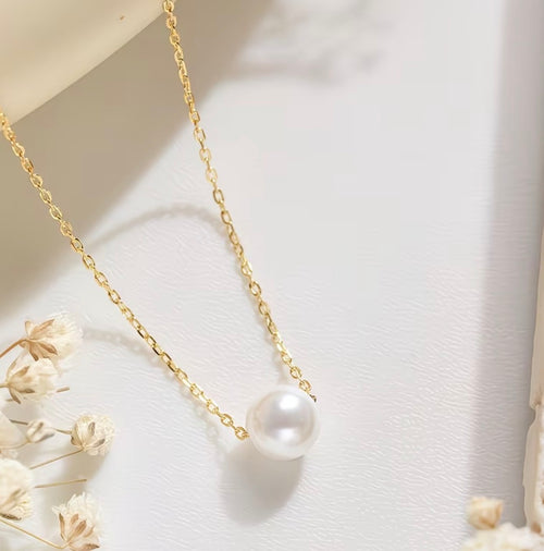 Cadena delicada de acero inoxidable con perla central